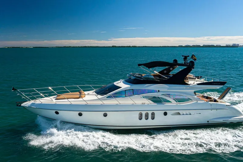 L’chaim Yacht Photos Pics Luxurious 2007 Azimut Fly 62 yacht cruising on open blue waters.