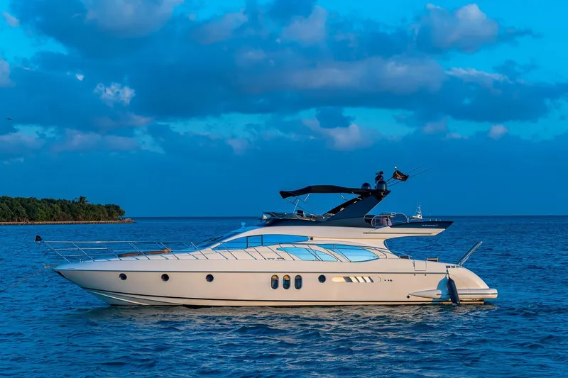 L’chaim Yacht Photos Pics 2007 Azimut Fly 62 yacht on calm blue sea under cloudy sky.