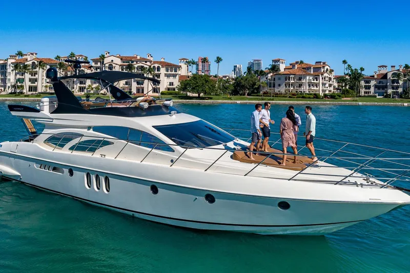 L’chaim Yacht Photos Pics 2007 Azimut Fly 62 yacht cruising near luxury waterfront homes.