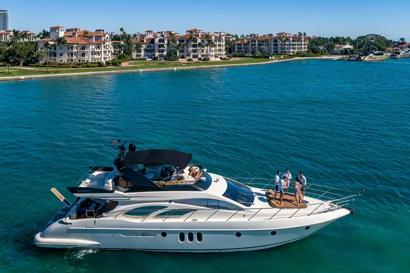 L’chaim Yacht Photos Pics 2007 Azimut Fly 62 yacht cruising near luxury waterfront residences.
