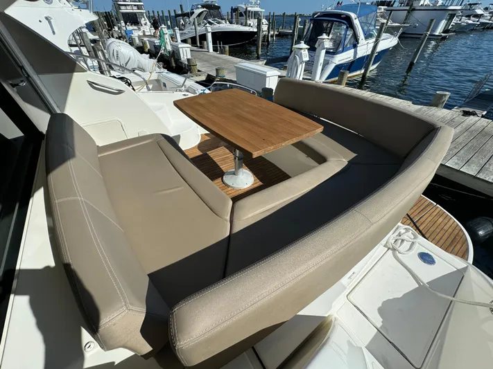  Yacht Photos Pics Prestige 440 S 2012 yacht with outdoor seating and table at marina.