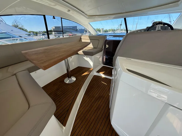  Yacht Photos Pics Interior of 2012 Prestige 440 S yacht with wooden flooring and seating area.