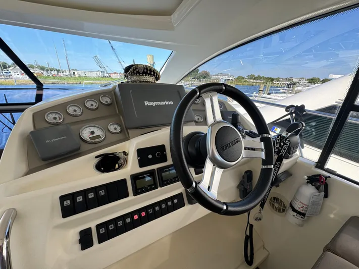  Yacht Photos Pics Prestige 440 S 2012 yacht helm with steering wheel and navigation controls.
