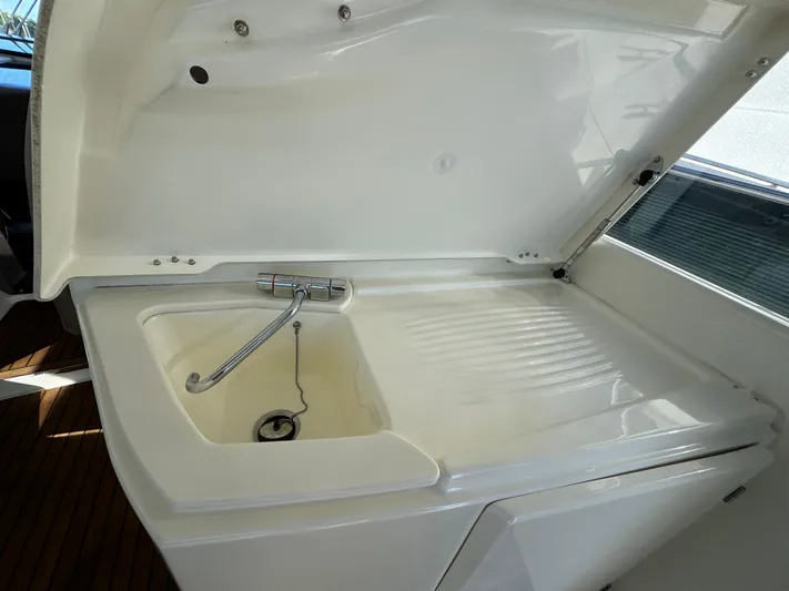  Yacht Photos Pics Prestige 440 S 2012 yacht sink with open lid and faucet.
