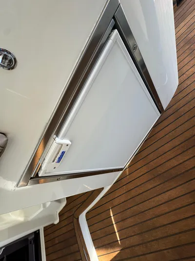  Yacht Photos Pics Prestige 440 S 2012 yacht with sleek white exterior and wooden deck.
