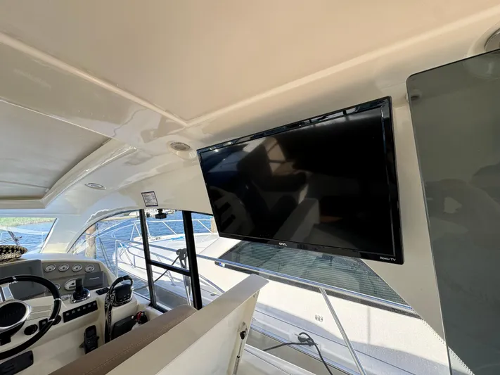  Yacht Photos Pics Interior of 2012 Prestige 440 S yacht with steering wheel and mounted TV.