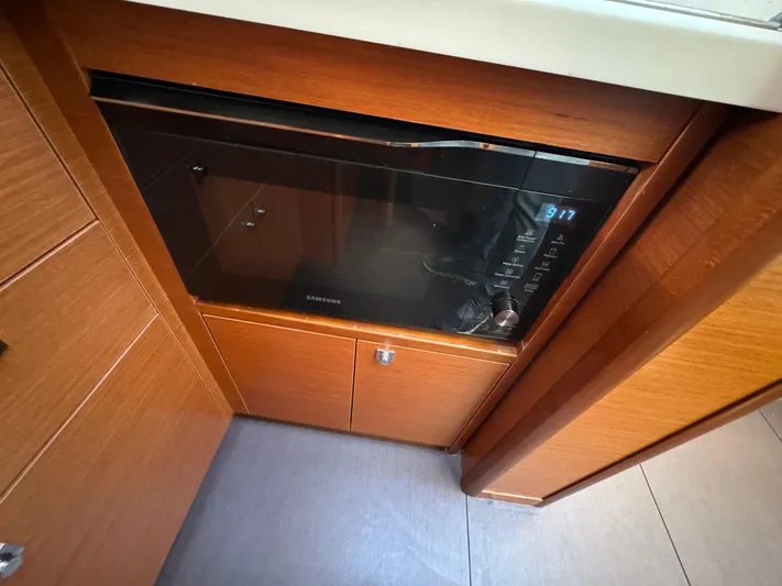  Yacht Photos Pics Microwave in 2012 Prestige 440 S yacht kitchen with wooden cabinetry.