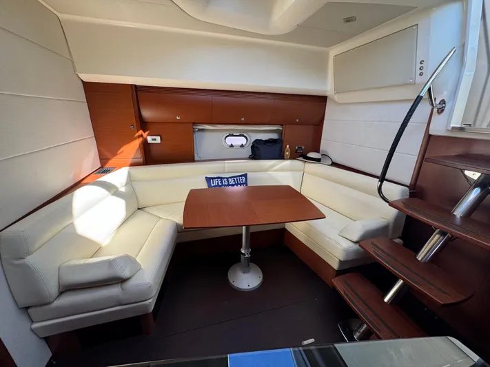  Yacht Photos Pics Luxurious interior of 2012 Prestige 440 S yacht with cozy seating and table.