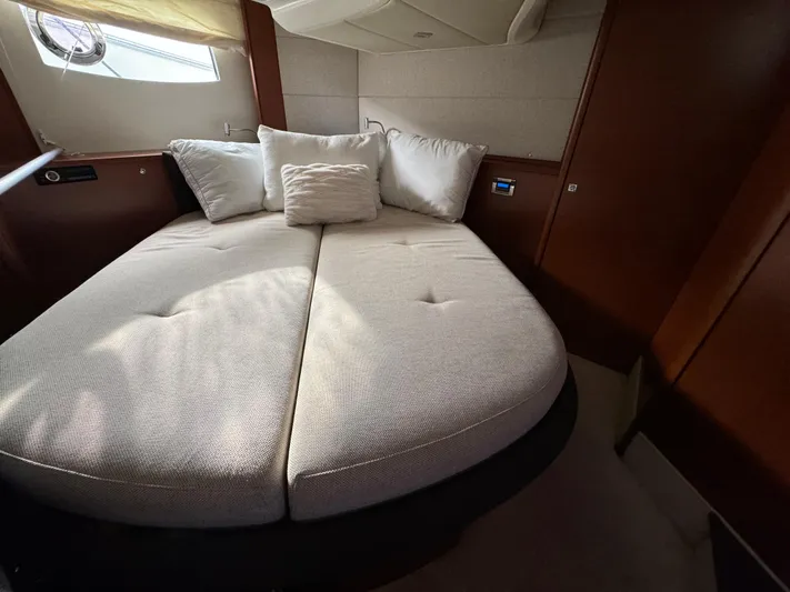  Yacht Photos Pics Luxurious cabin interior of 2012 Prestige 440 S yacht with cozy bed and pillows.