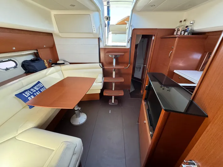  Yacht Photos Pics Luxurious interior of 2012 Prestige 440 S yacht with elegant wood finishes.