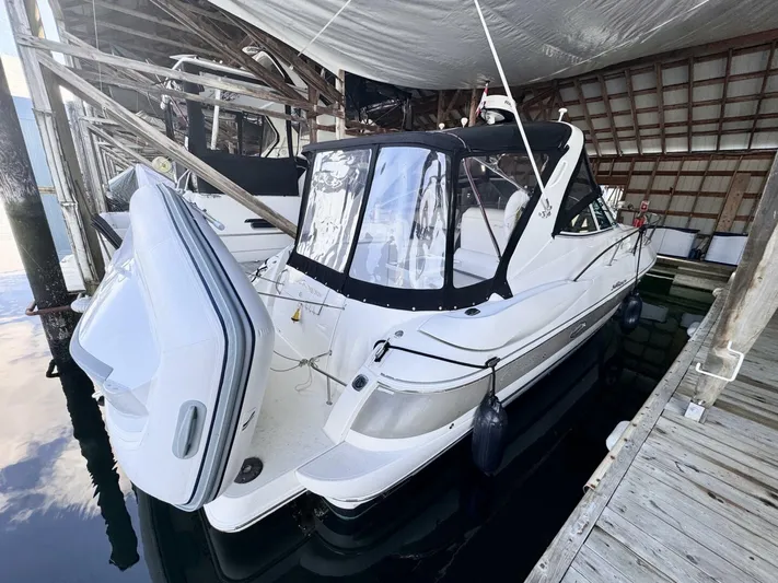  Yacht Photos Pics 2006 Cruisers Yachts 340 Express docked in a covered marina.