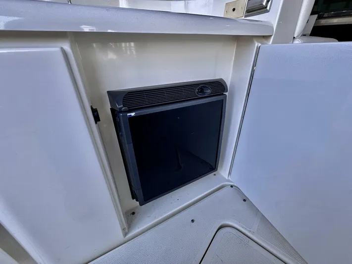  Yacht Photos Pics 2006 Cruisers Yachts 340 Express interior with built-in mini fridge.