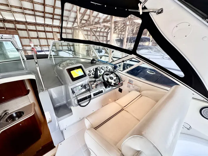  Yacht Photos Pics 2006 Cruisers Yachts 340 Express helm with modern controls and comfortable seating.