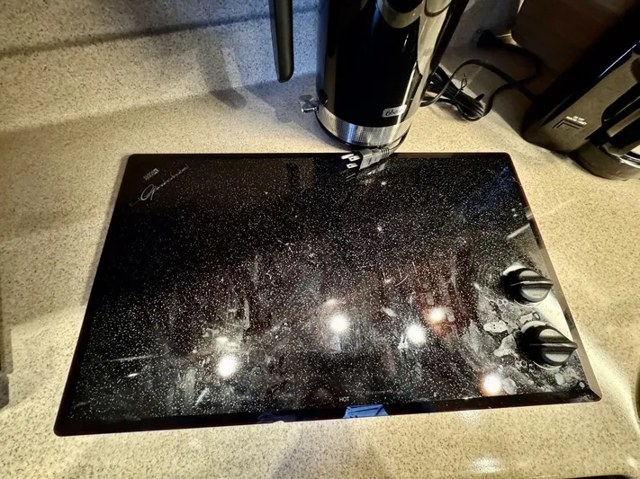  Yacht Photos Pics Glass cooktop on 2006 Cruisers Yachts 340 Express, featuring sleek design and modern controls.