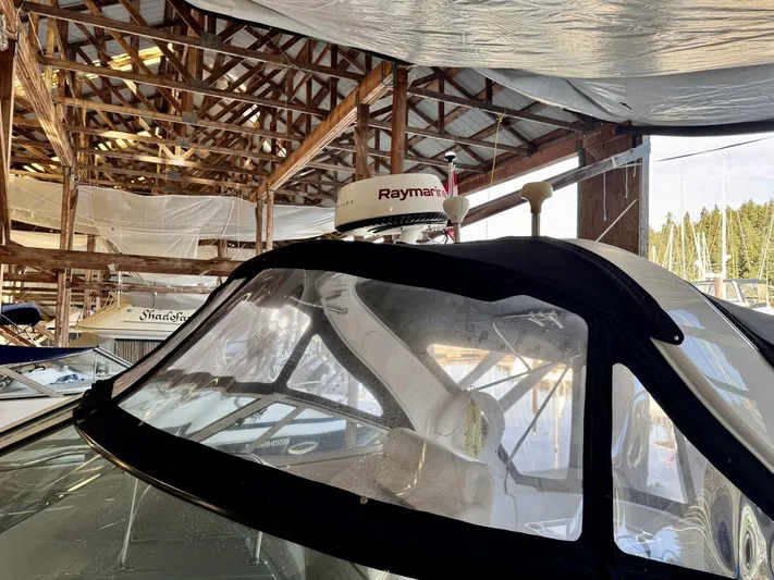  Yacht Photos Pics 2006 Cruisers Yachts 340 Express in a boat shed with Raymarine radar.