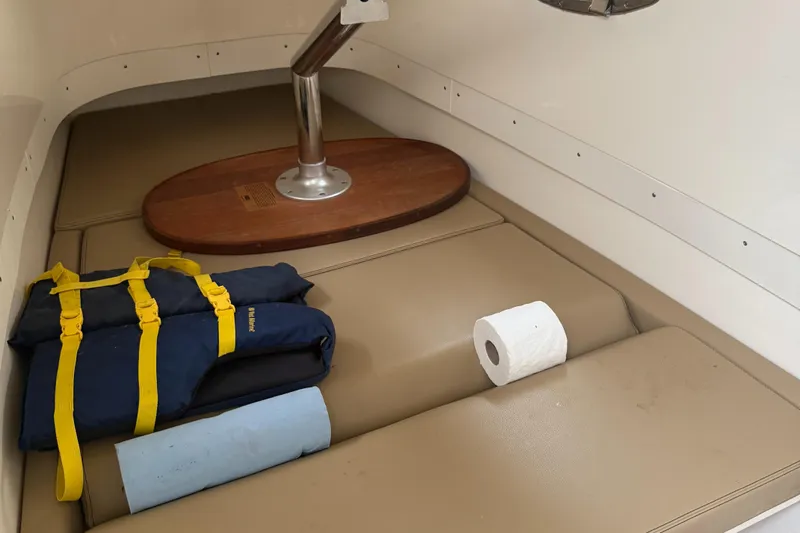  Yacht Photos Pics Interior of 2015 Scout 300 LXF boat with life jackets and supplies.