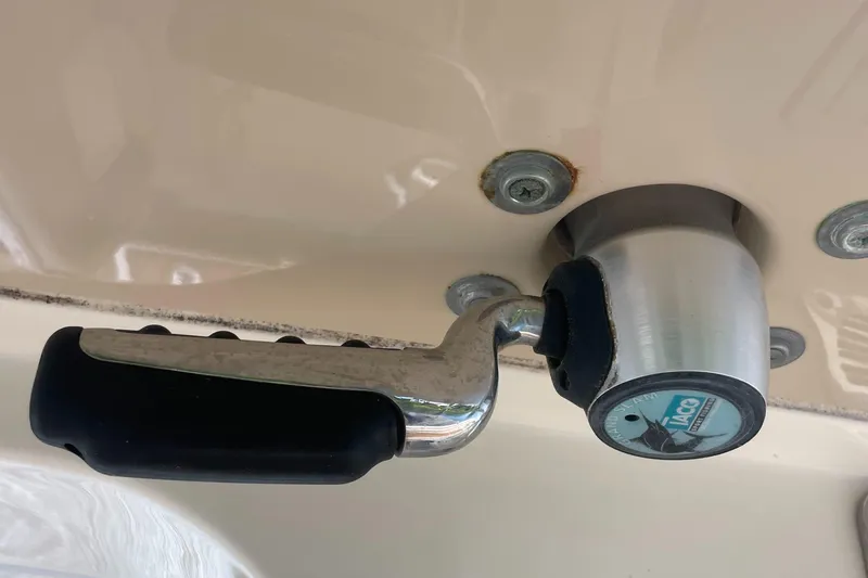  Yacht Photos Pics Stainless steel handle on 2015 Scout 300 LXF boat, featuring a YACHT logo.