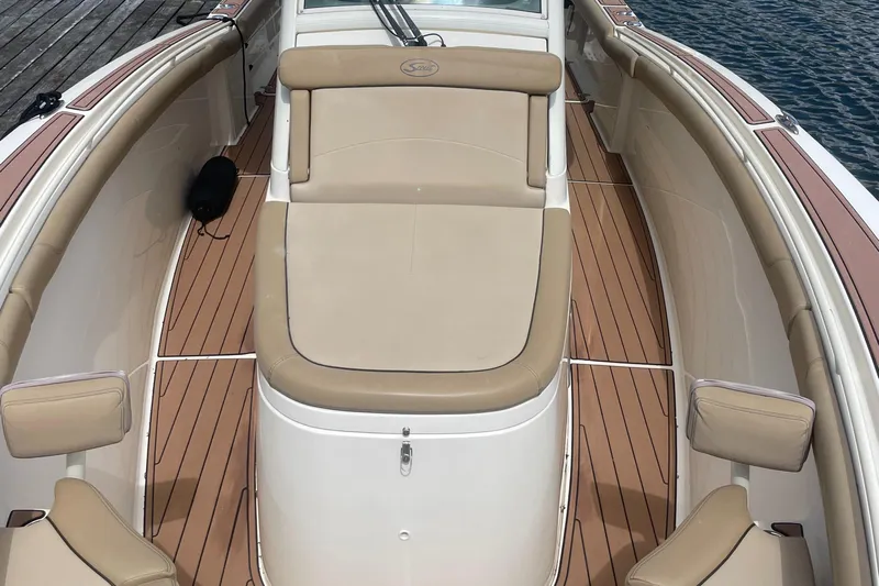  Yacht Photos Pics 2015 Scout 300 LXF boat interior with tan seating and wood-style flooring.