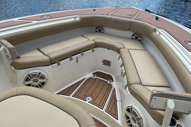  Yacht Photos Pics 2015 Scout 300 LXF boat interior with tan seating and wood accents.
