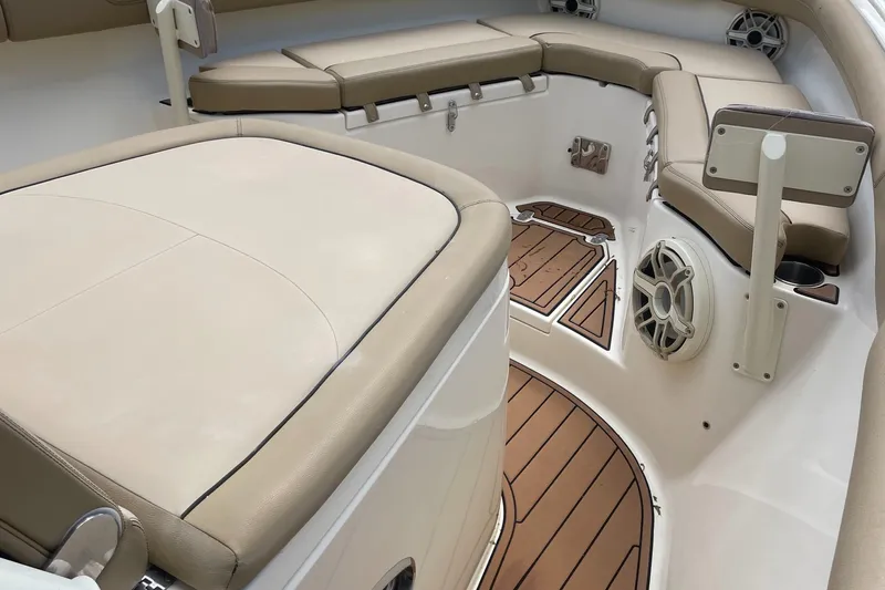  Yacht Photos Pics Luxurious interior of 2015 Scout 300 LXF boat with cushioned seating and teak flooring.