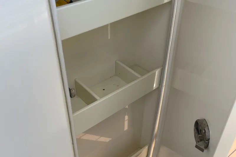  Yacht Photos Pics Open storage compartment on 2015 Scout 300 LXF boat.