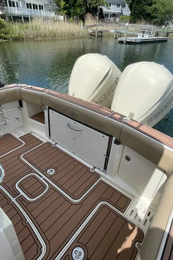  Yacht Photos Pics 2015 Scout 300 LXF boat with Yamaha engines, featuring teak-style deck and waterfront view.