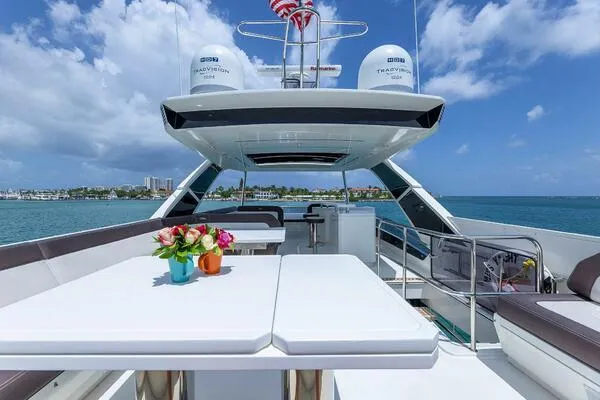  Yacht Photos Pics Luxurious 2019 Galeon 640 Fly yacht deck with dining area and ocean view.