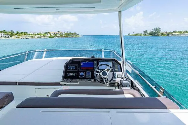  Yacht Photos Pics 2019 Galeon 640 Fly yacht helm with ocean view, featuring modern navigation equipment.