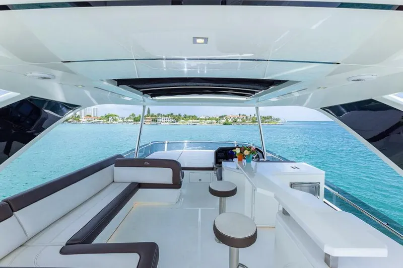  Yacht Photos Pics Luxurious 2019 Galeon 640 Fly yacht interior with ocean view, featuring sleek seating and modern design.