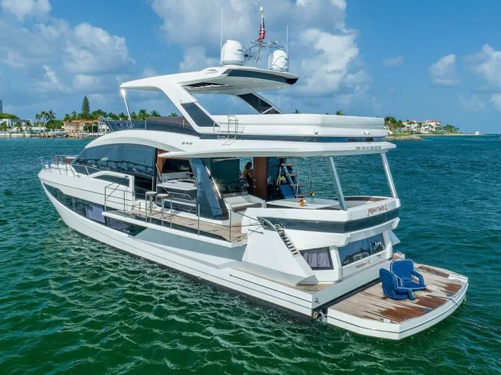  Yacht Photos Pics Luxurious 2019 Galeon 640 Fly yacht cruising on clear blue waters.