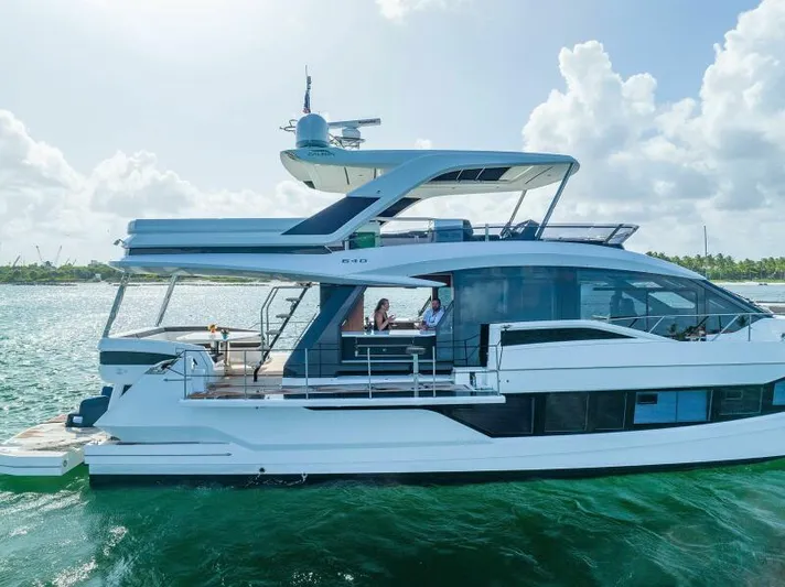  Yacht Photos Pics Luxury 2019 Galeon 640 Fly yacht cruising on open water under a clear sky.