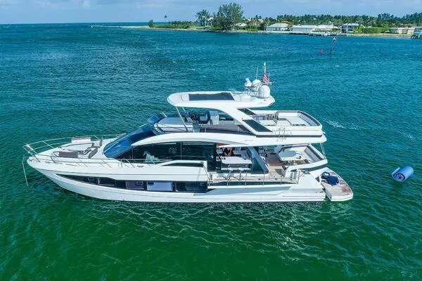  Yacht Photos Pics 2019 Galeon 640 Fly yacht cruising on clear blue waters.