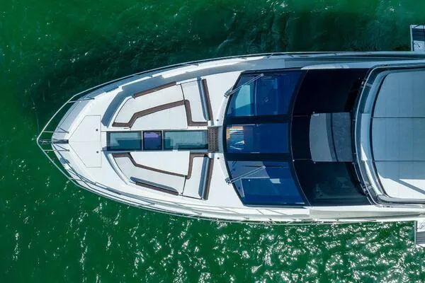  Yacht Photos Pics Aerial view of 2019 Galeon 640 Fly yacht on green water.