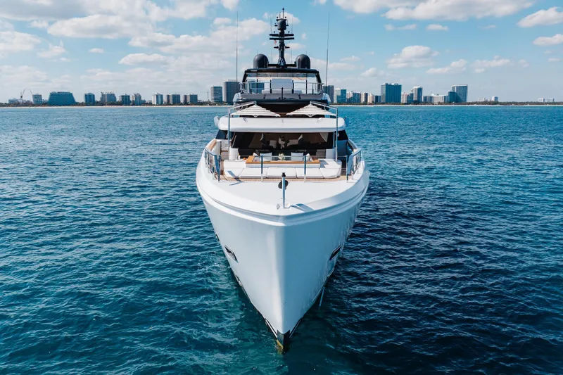 Neverland II Yacht Photos Pics Luxurious 2020 Sanlorenzo 44 Alloy yacht on open sea with city skyline backdrop.