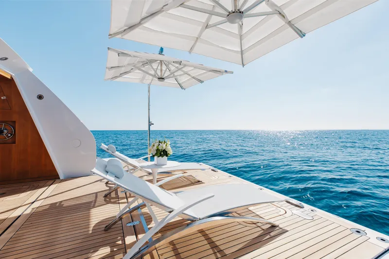 Neverland II Yacht Photos Pics Luxurious Sanlorenzo 44 Alloy yacht deck with sun loungers and ocean view, 2020 model.