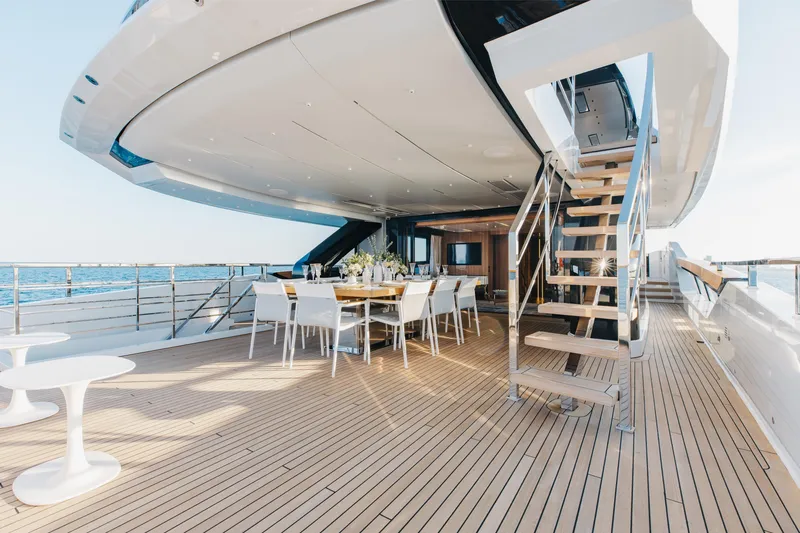 Neverland II Yacht Photos Pics Luxurious 2020 Sanlorenzo 44 Alloy yacht deck with dining area and ocean view.
