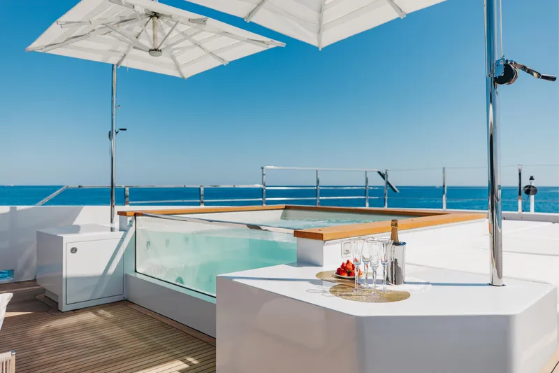 Neverland II Yacht Photos Pics Luxurious Sanlorenzo 44 Alloy yacht deck with jacuzzi, champagne, and ocean view, 2020 model.
