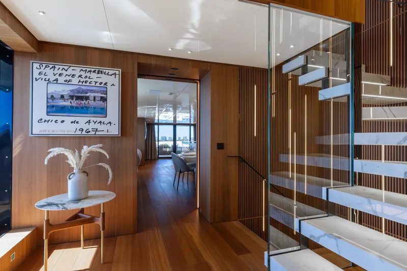Neverland II Yacht Photos Pics Luxurious interior of 2020 Sanlorenzo 44 Alloy yacht with modern staircase and elegant decor.
