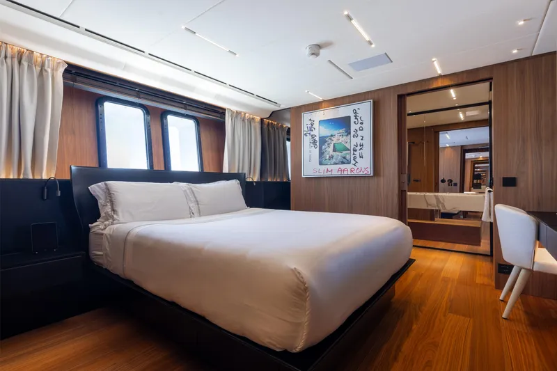 Neverland II Yacht Photos Pics Luxurious bedroom interior on 2020 Sanlorenzo 44 Alloy yacht, featuring modern design and elegant furnishings.