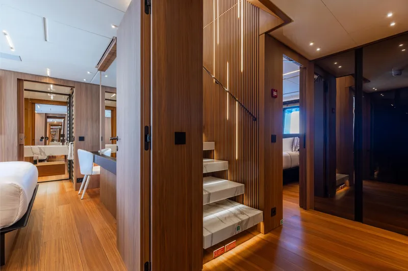 Neverland II Yacht Photos Pics Luxurious interior of 2020 Sanlorenzo 44 Alloy yacht with modern wooden design and elegant staircase.
