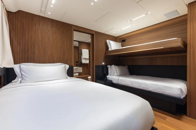 Neverland II Yacht Photos Pics Luxurious Sanlorenzo 44 Alloy 2020 yacht cabin with modern wood paneling and elegant bedding.