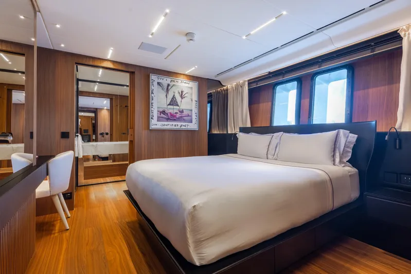 Neverland II Yacht Photos Pics Luxurious bedroom interior on 2020 Sanlorenzo 44 Alloy yacht with modern design and wood accents.