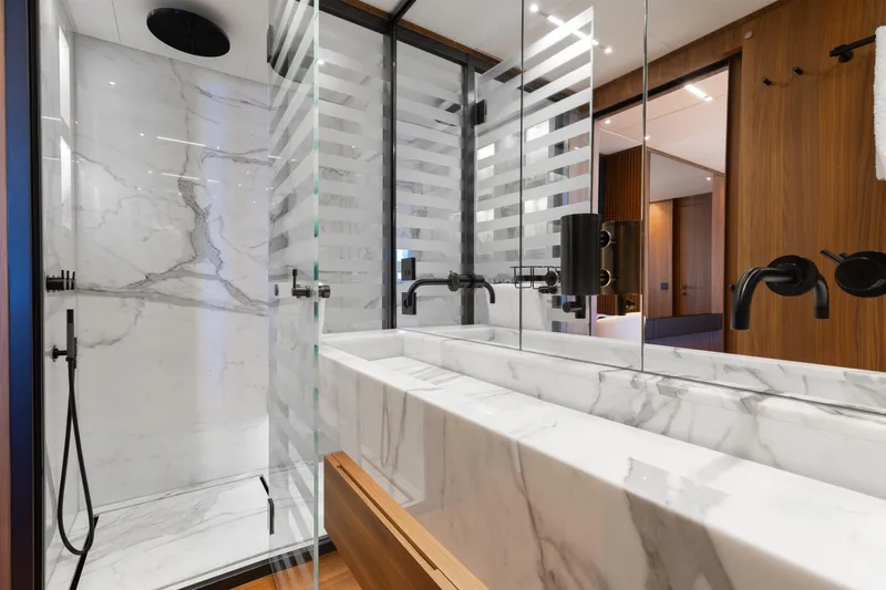 Neverland II Yacht Photos Pics Luxurious marble bathroom in 2020 Sanlorenzo 44 Alloy yacht, featuring modern fixtures and elegant design.