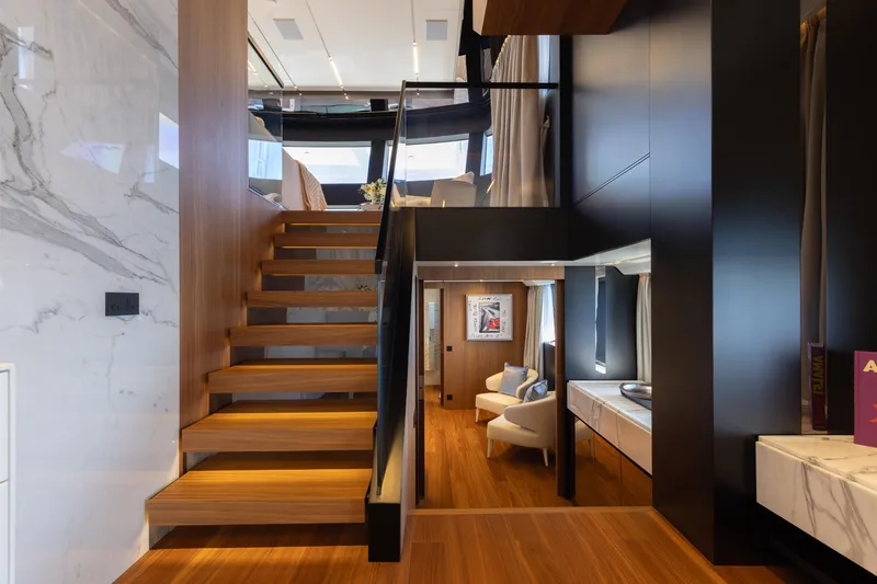 Neverland II Yacht Photos Pics Luxurious interior of 2020 Sanlorenzo 44 Alloy yacht with modern staircase and elegant decor.