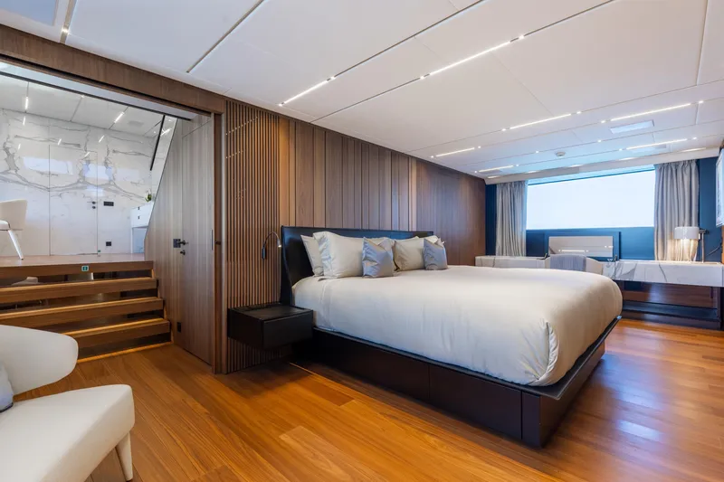 Neverland II Yacht Photos Pics Luxurious bedroom interior on 2020 Sanlorenzo 44 Alloy yacht, featuring modern design and elegant furnishings.