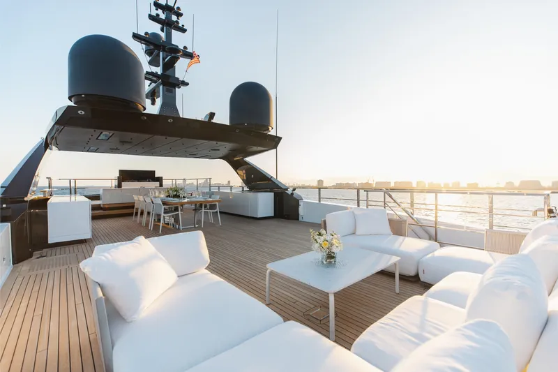 Neverland II Yacht Photos Pics Luxurious 2020 Sanlorenzo 44 Alloy yacht deck with elegant seating and dining area at sunset.