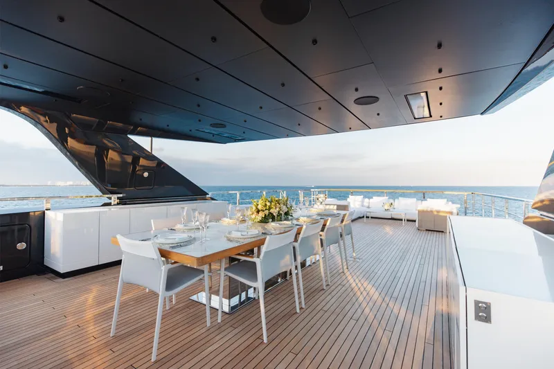 Neverland II Yacht Photos Pics Luxurious 2020 Sanlorenzo 44 Alloy yacht deck with elegant dining setup and ocean view.