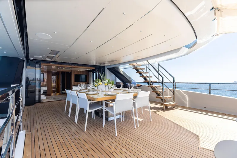 Neverland II Yacht Photos Pics Luxurious 2020 Sanlorenzo 44 Alloy yacht deck with elegant dining setup and ocean view.