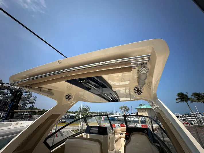  Yacht Photos Pics 2022 Scout 277 Dorado boat interior with hardtop and marina background.