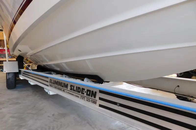  Yacht Photos Pics 2003 Regulator 32 Center Console on aluminum slide-on trailer in garage.